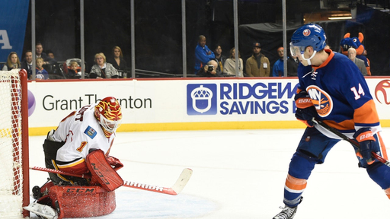 Hickey's OT goal helps Isles stay strong at home vs Flames